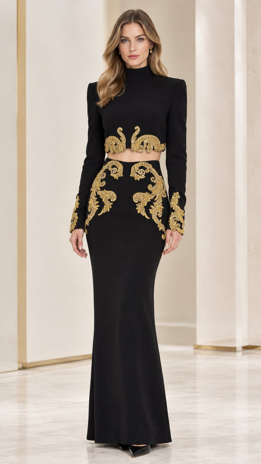 Front full-length view of woman wearing Black two-piece formal dress with gold embroidery