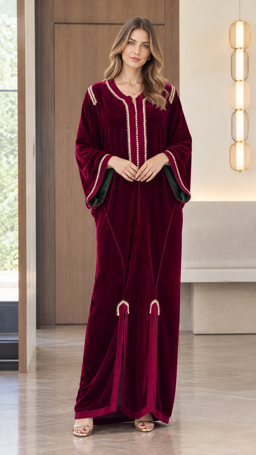 Full front view of model wearing a Burgundy velvet kaftan maxi dress with gold braided embroidery