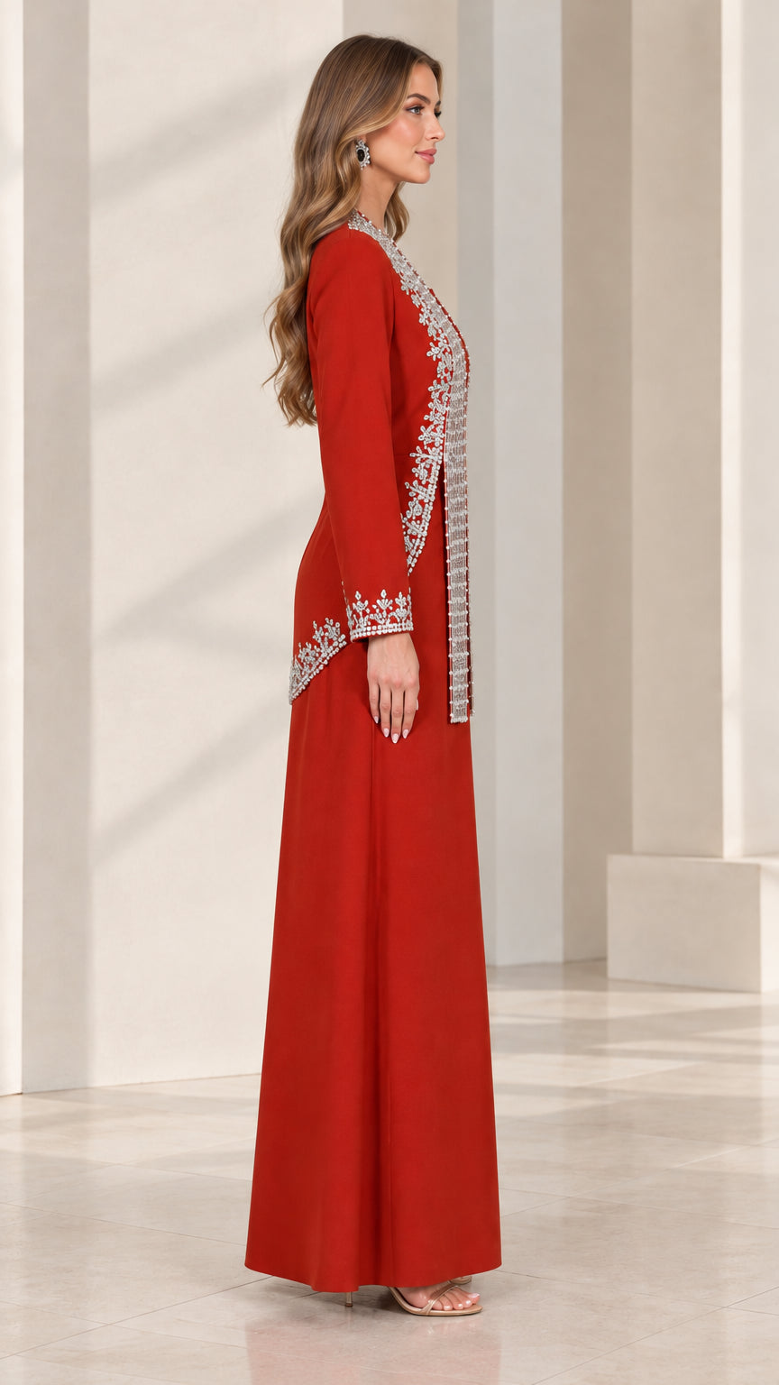 Side profile view of woman modeling red two-piece formal jumpsuit set