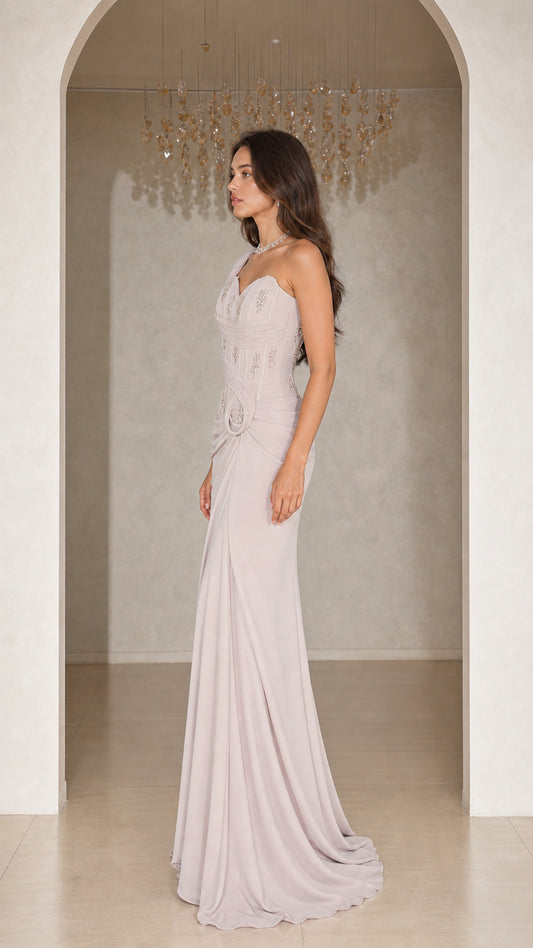Side view of woman wearing silver grey one-shoulder formal dress