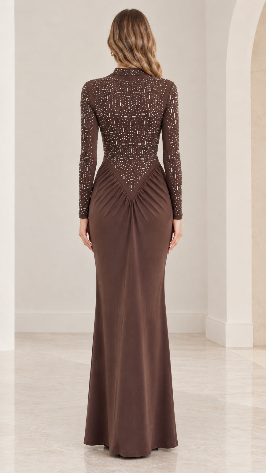 Back full-length view of brown rhinestone long sleeve evening gown