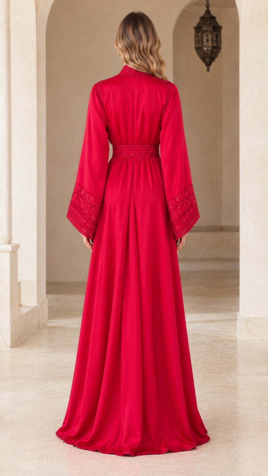 Back view of model in red belted kaftan evening gown