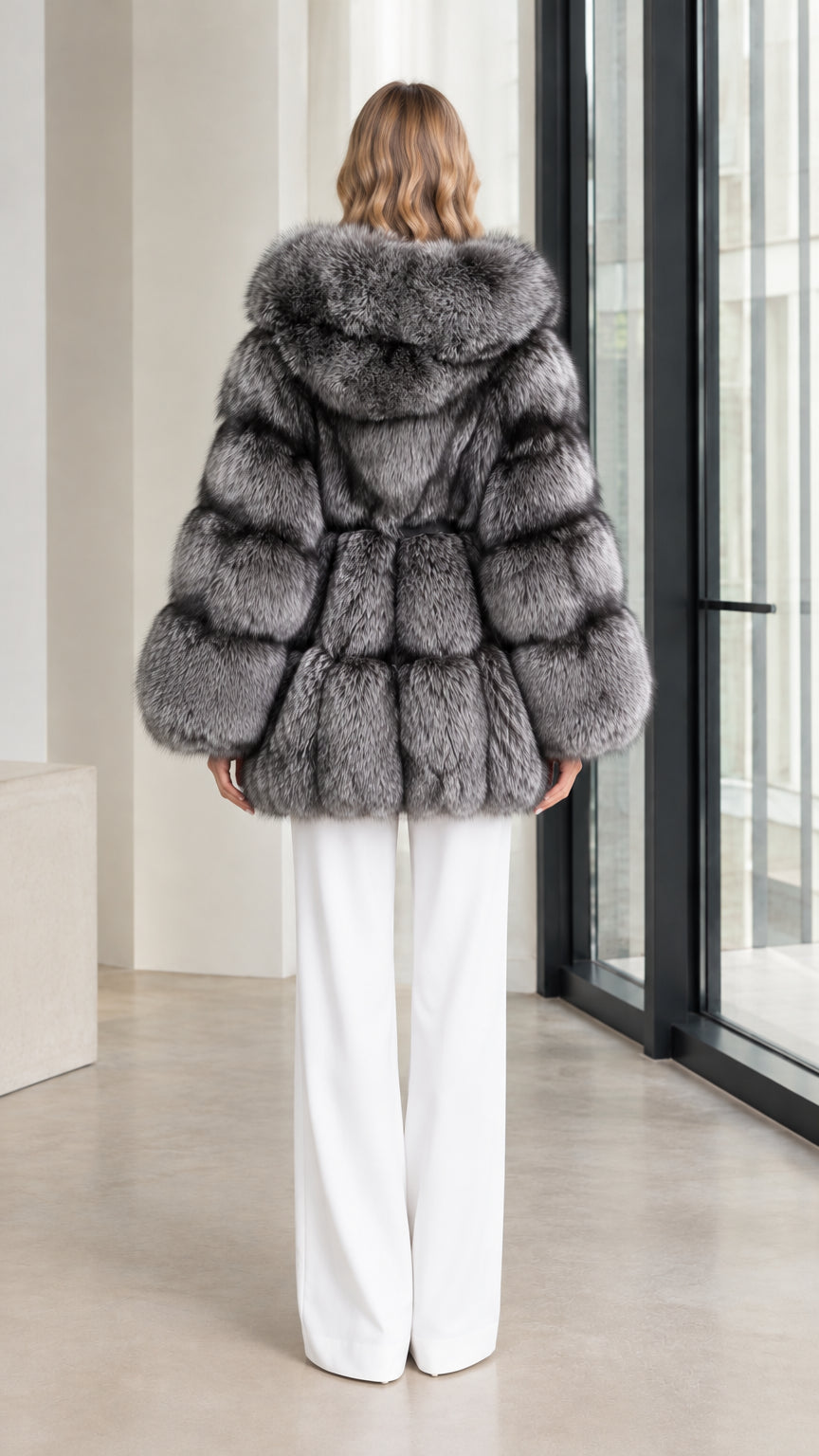 Back view of the silver grey tiered faux fur hooded coat