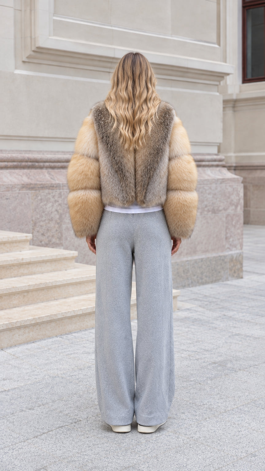 Back view of model wearing Honey Camel cropped fur jacket