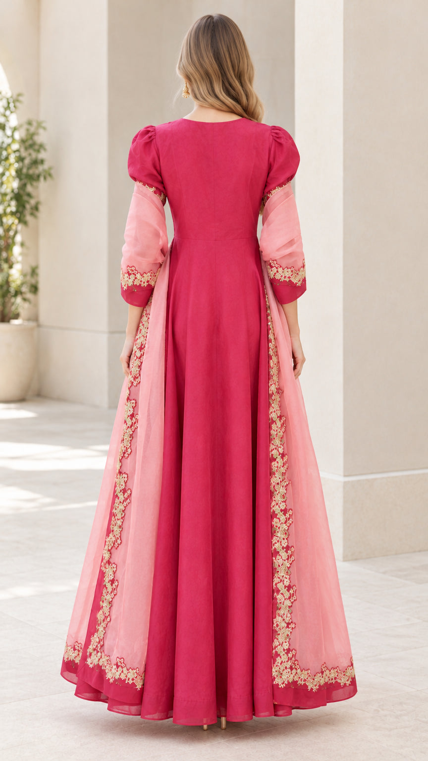 Back view of fuchsia pink maxi dress showing floor-length flowing drape
