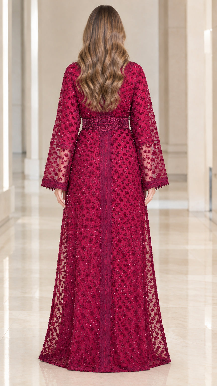 Back view of woman wearing magenta floor-length lace kaftan dress