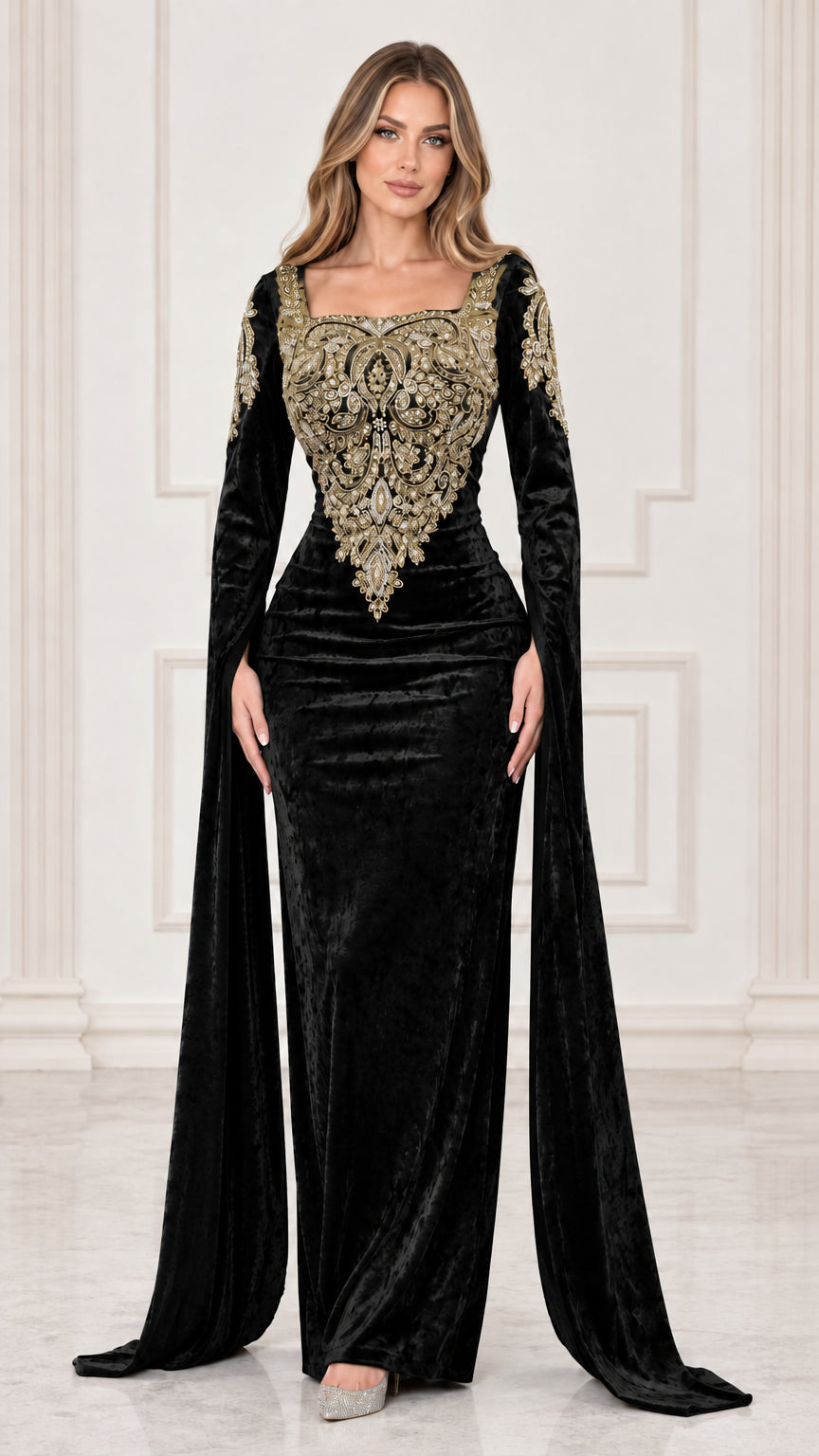 Front view of black velvet evening gown with ornate gold embroidery and cape sleeves