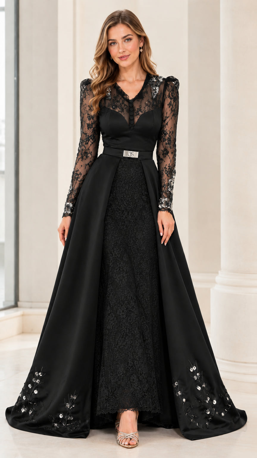 Model wearing Black long sleeve illusion lace evening gown with overskirt