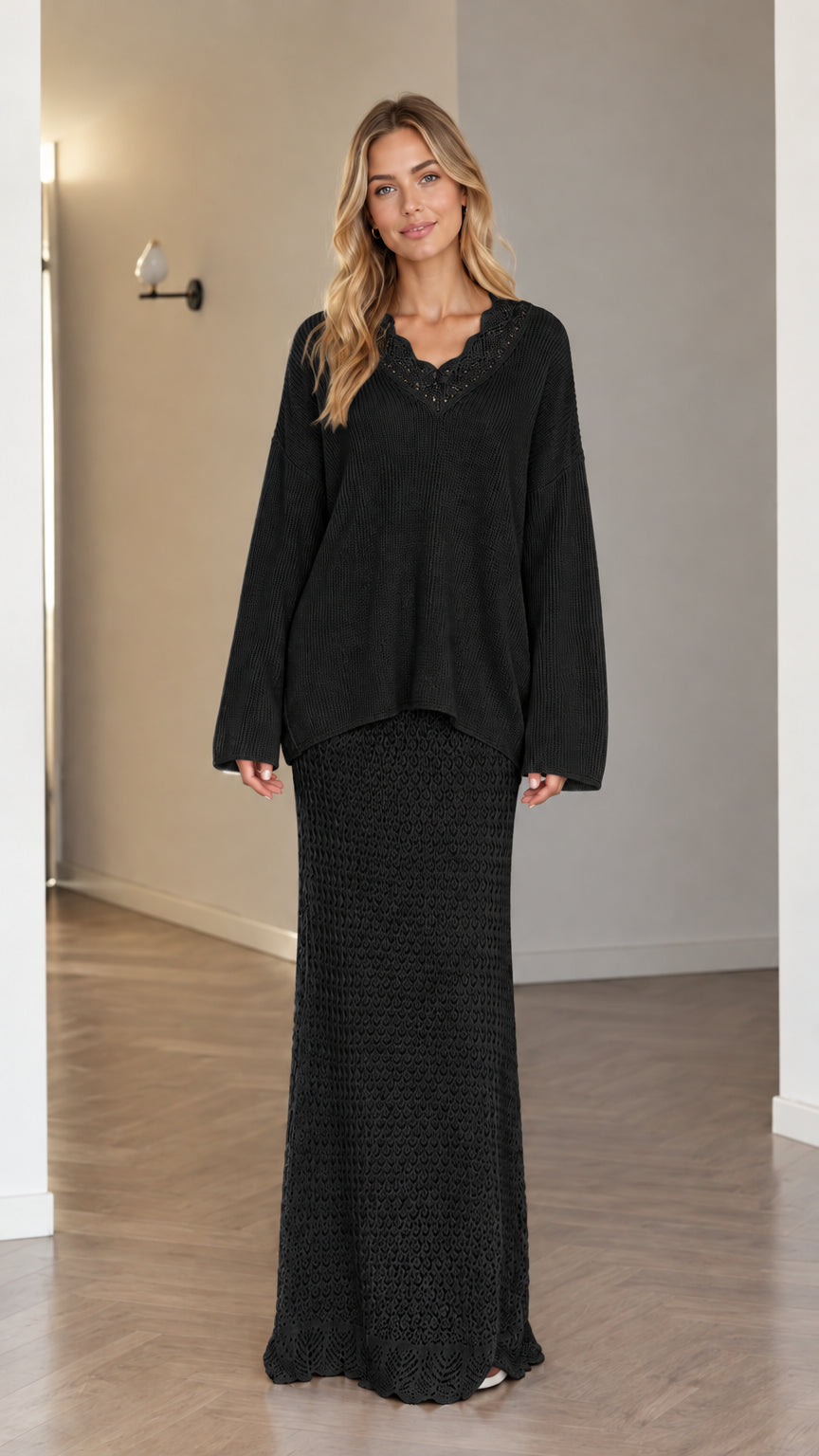 Model wearing black two-piece crochet V-neck sweater and maxi skirt set