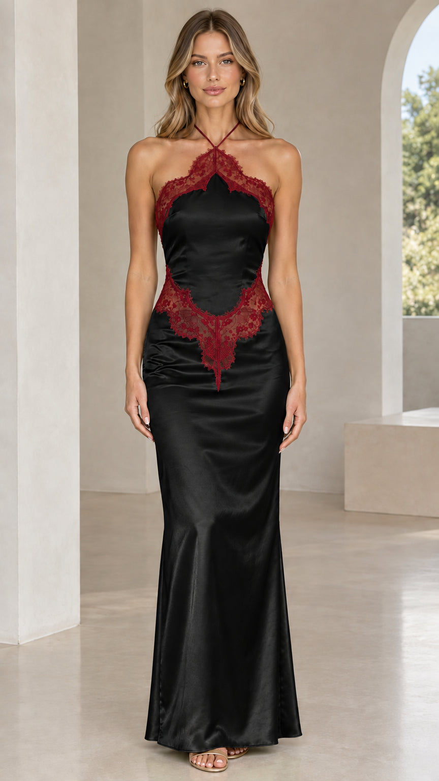 Front view of model wearing black satin halter maxi dress with burgundy lace trim