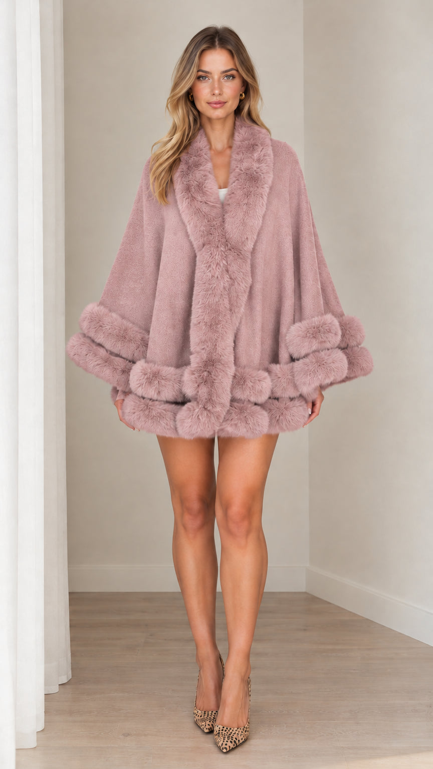 Model wearing dusty rose faux fur trim cape coat with plush collar