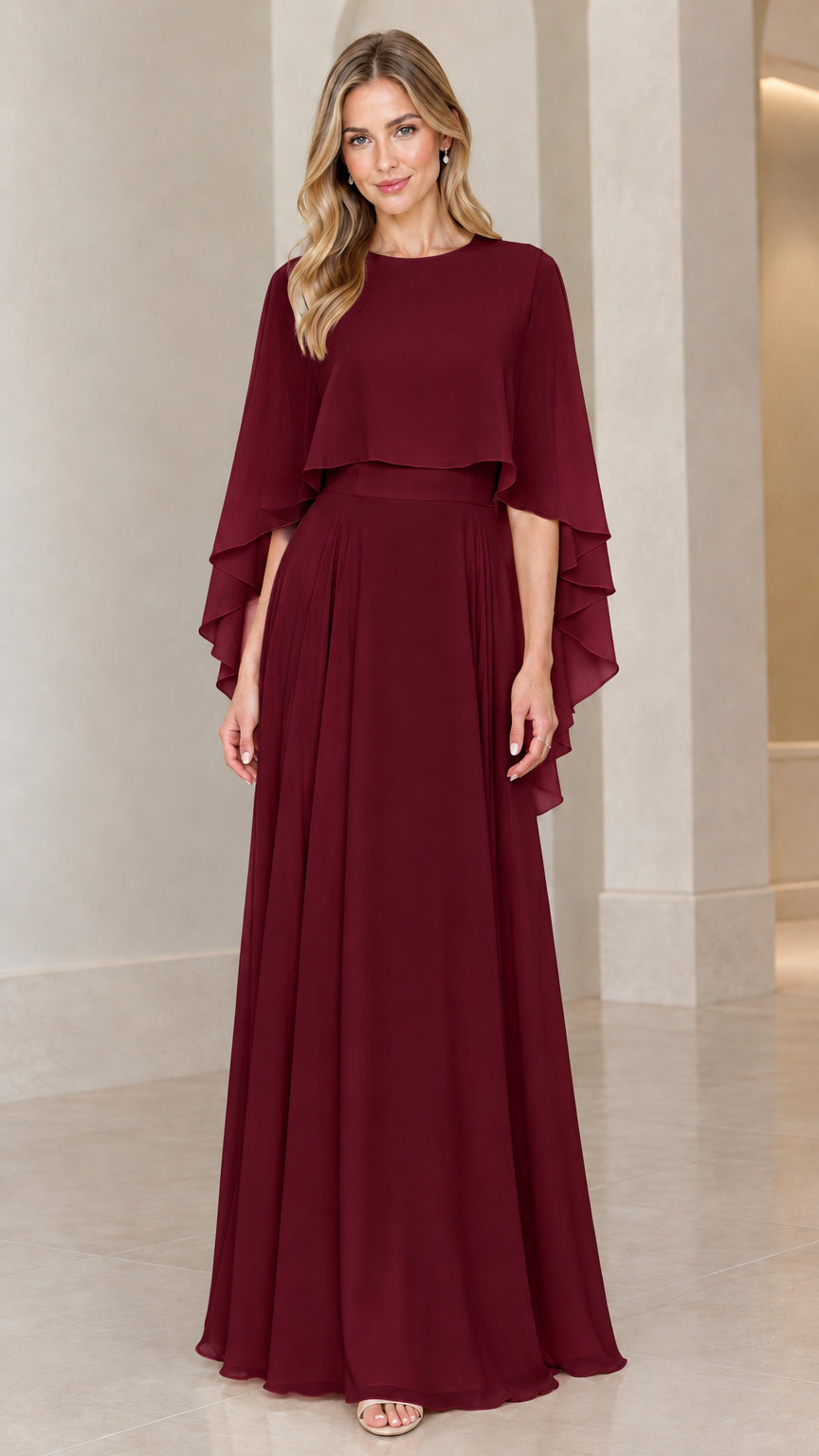 Front view of model wearing burgundy wine chiffon capelet evening maxi dress