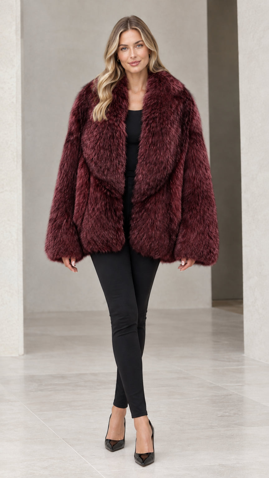 Front view of woman wearing deep wine burgundy faux fur coat