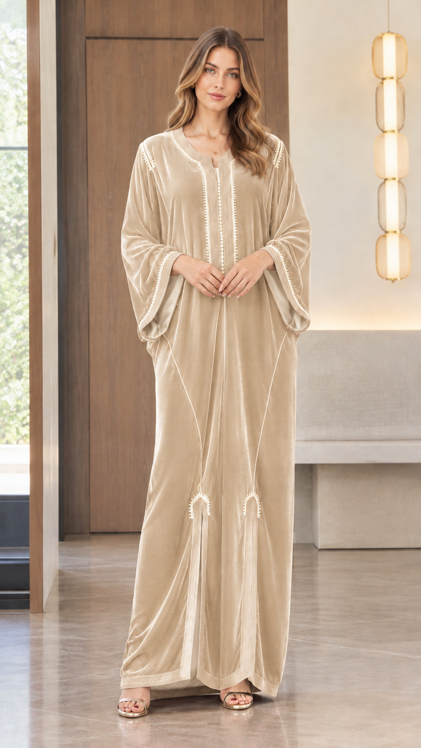 Full front view of model wearing the Champagne beige embroidered velvet kaftan maxi dress