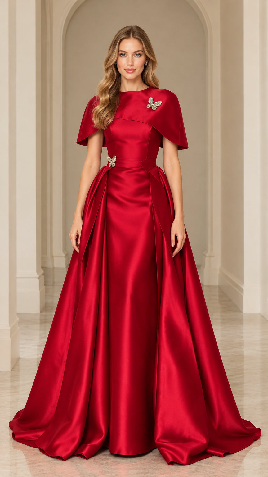 Full-length front view of red satin capelet evening gown with crystal butterfly accents