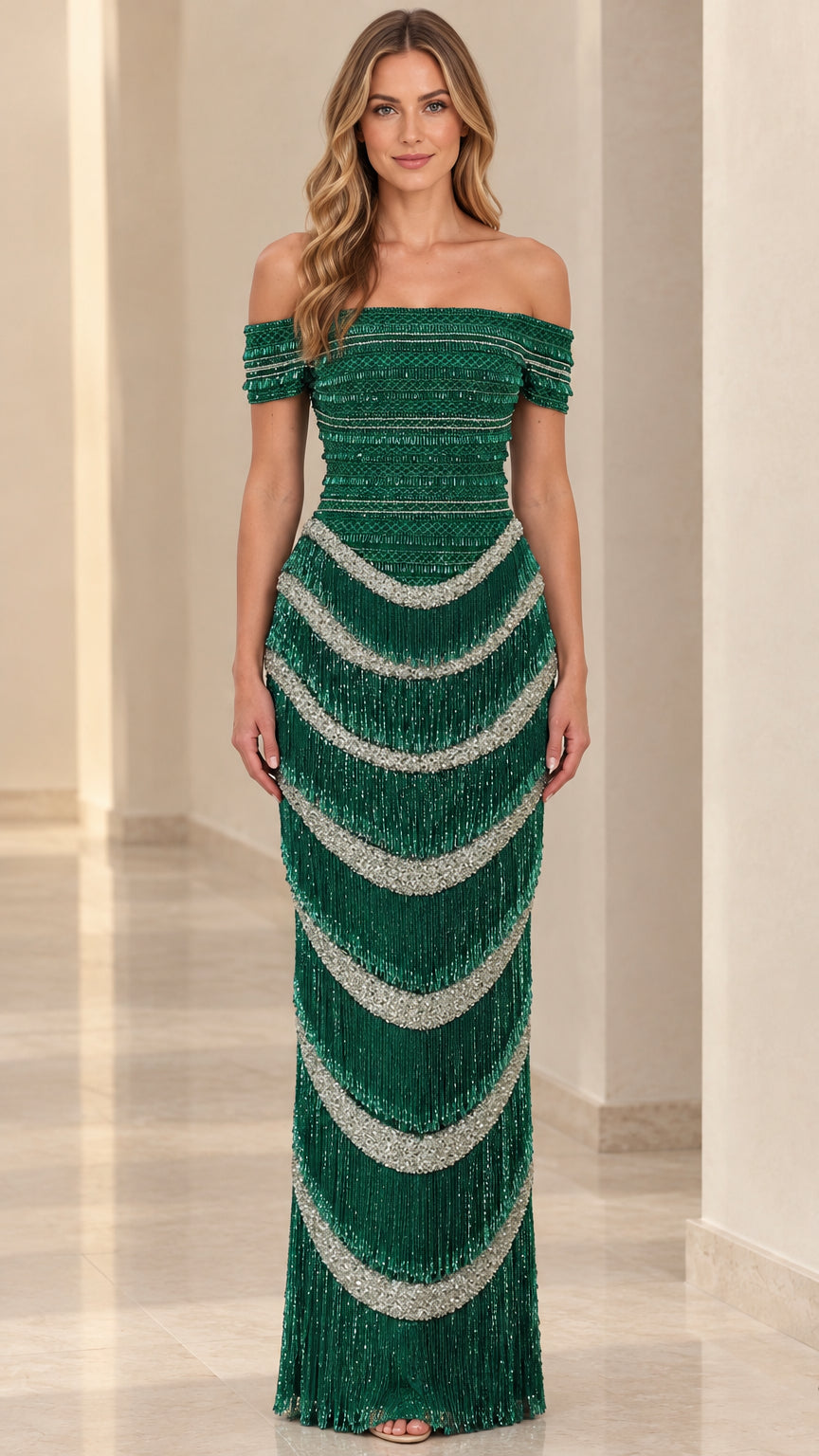Front view of model wearing emerald green off-the-shoulder beaded fringe evening gown
