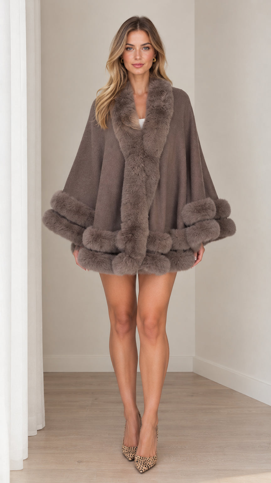 Front view of model wearing taupe faux fur trim cape coat with heels