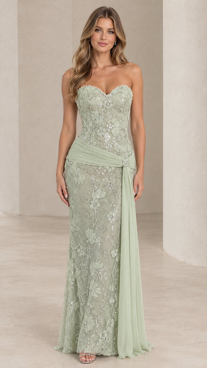 Front full view of woman wearing sage green strapless beaded lace evening gown with draped sash