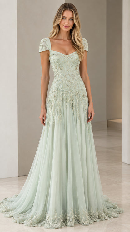 Front view of model wearing Sage Green beaded cap sleeve tulle evening gown