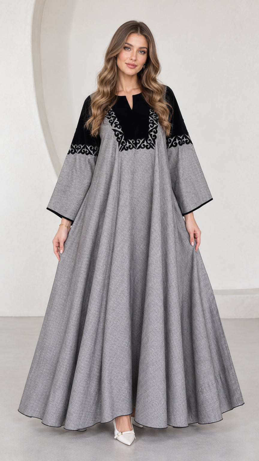 Front full-length view of woman wearing grey embroidered contrast yoke maxi dress