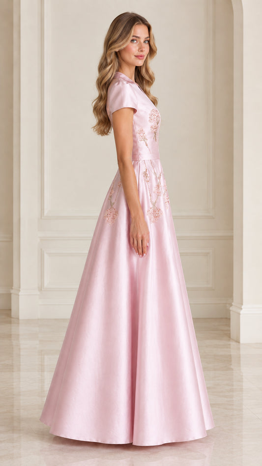 Side profile of model wearing Blush Pink formal evening dress