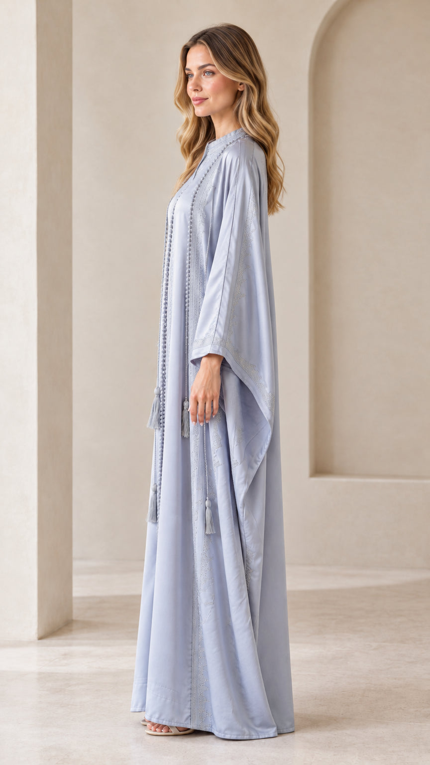Side profile view of Dusty Blue batwing kaftan maxi dress showing fluid drape