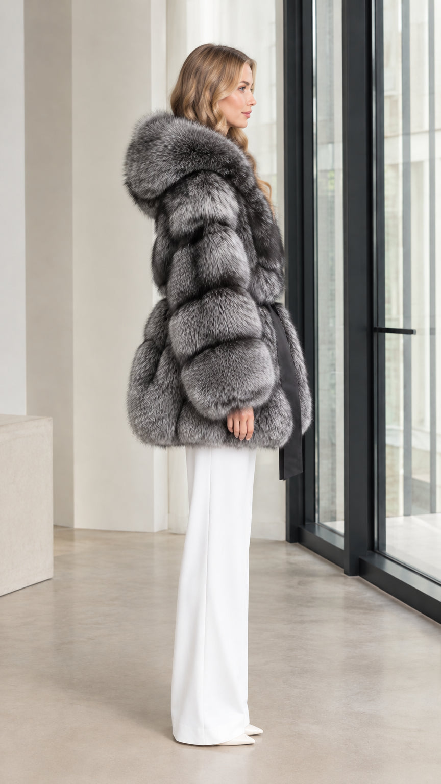 Side profile view of the silver grey belted faux fur hooded coat