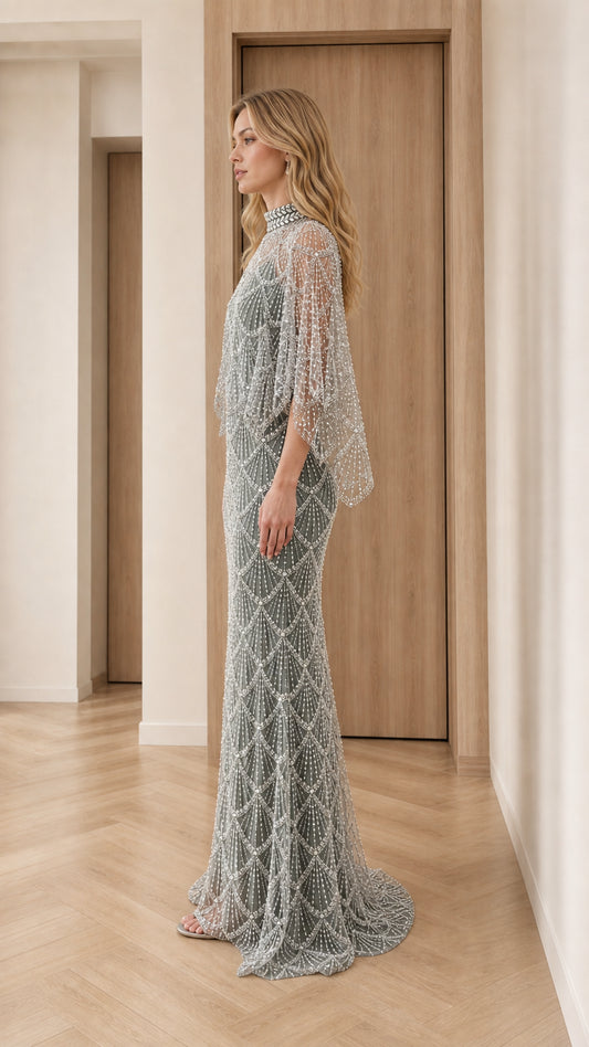 Side profile view of sage green beaded floor-length formal dress