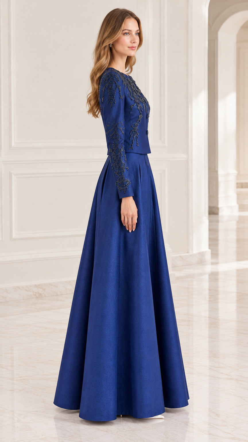 Side profile view of royal blue beaded formal dress showing structured tailoring and sleeve details