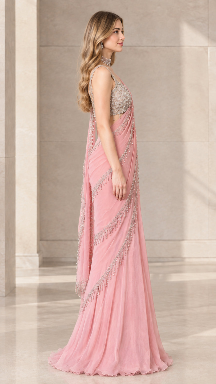 Side profile view of Blush Pink pre-draped saree gown showing elegant drape and beaded fringe