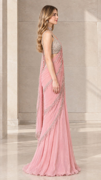 Side profile view of Blush Pink pre-draped saree gown showing elegant drape and beaded fringe