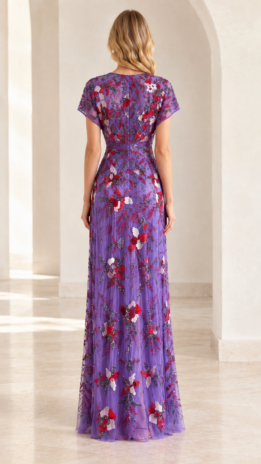 Back view of model in purple embroidered formal gown
