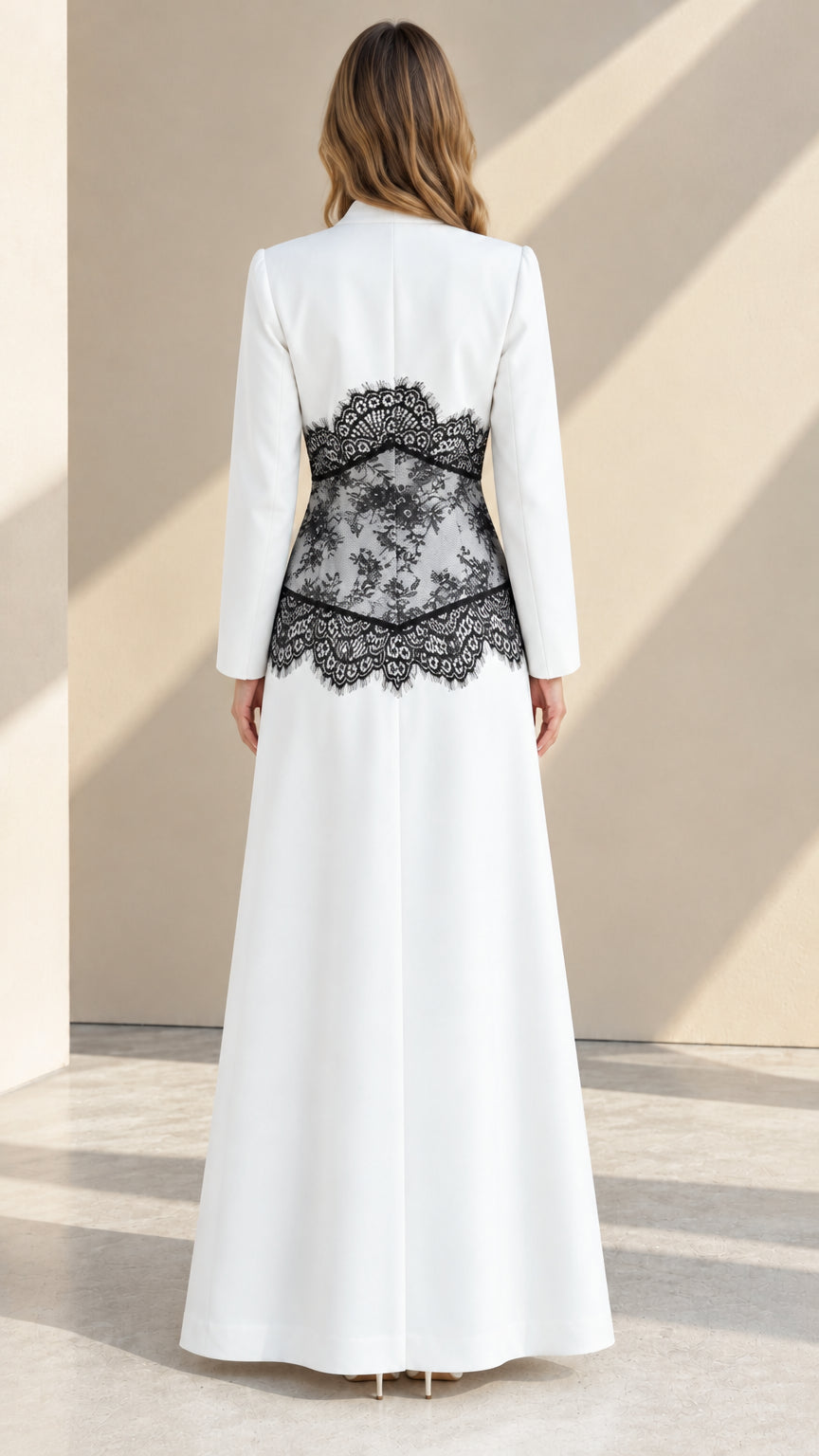 Back view of white formal pant set highlighting floral lace detail across the waist