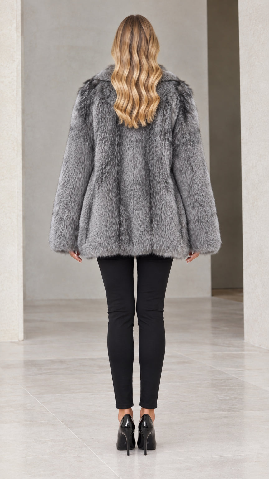 Back view of woman wearing silver grey plush faux fur coat