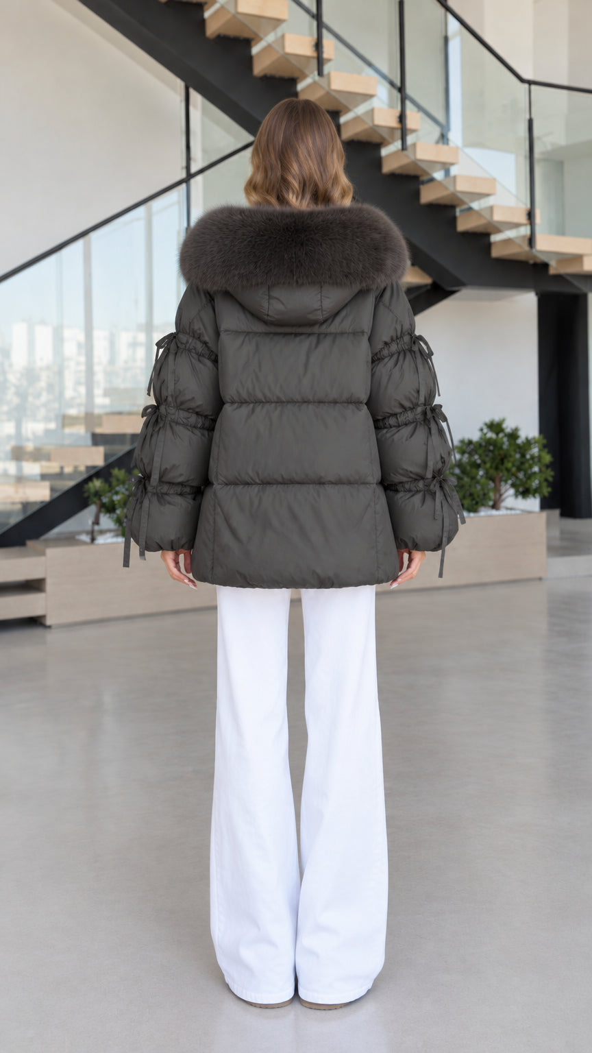 Back view of women's charcoal hooded winter puffer jacket