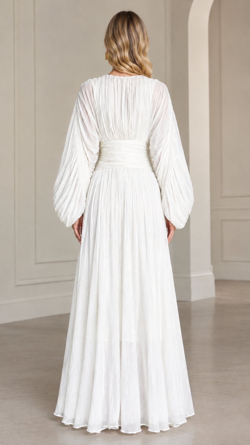 Back view of woman wearing elegant white pleated evening maxi gown
