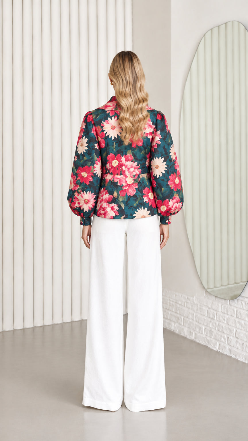 Back view of model wearing dark teal floral balloon sleeve jacket