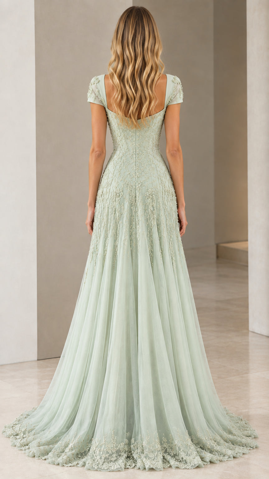 Back view of model wearing Sage Green cap sleeve evening gown with sweeping train