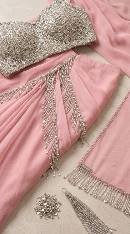 Close-up detail of silver sequin blouse, beaded fringe trim, and delicate fabric texture