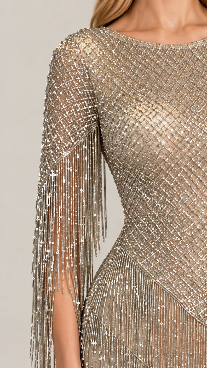 Close-up detail of intricate beadwork and tassel fringe sleeve in Champagne