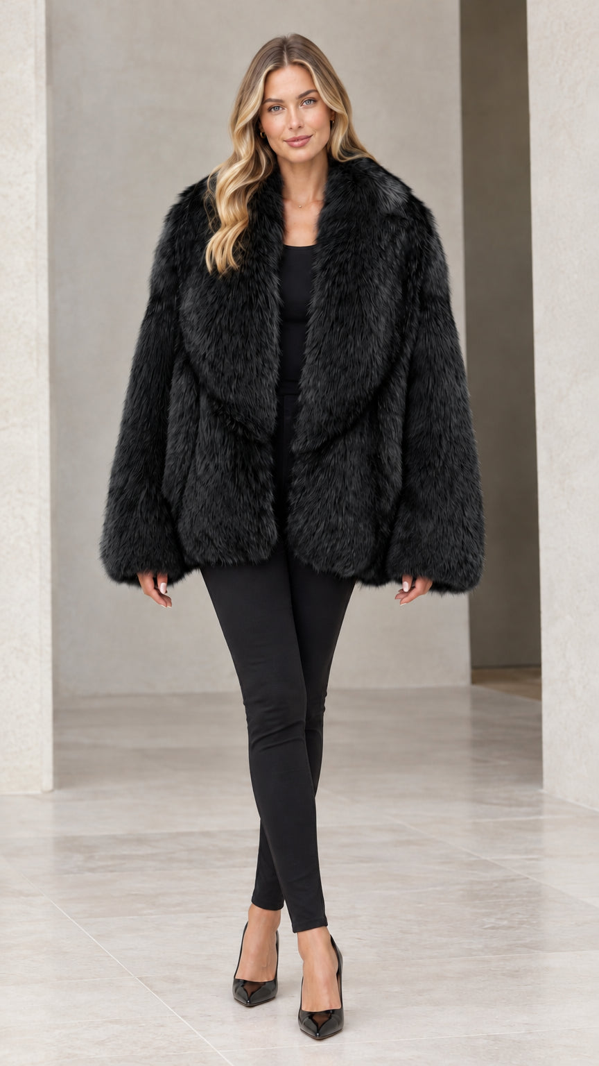 Front view of woman wearing classic black faux fur coat with wide collar