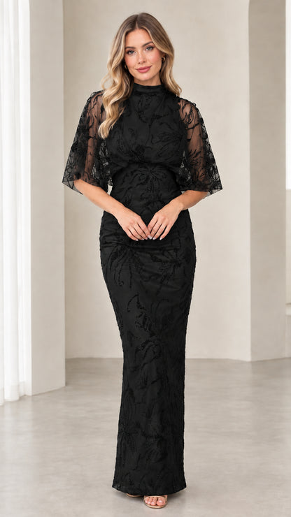 Model wearing Black high neck beaded evening gown with capelet sleeves