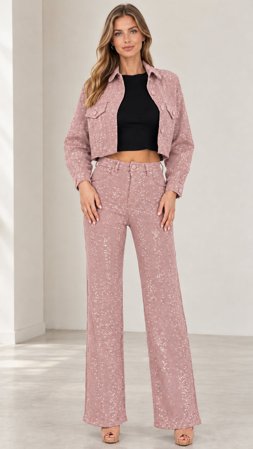 Front view of woman wearing dusty pink sparkle cropped jacket and pants two-piece set