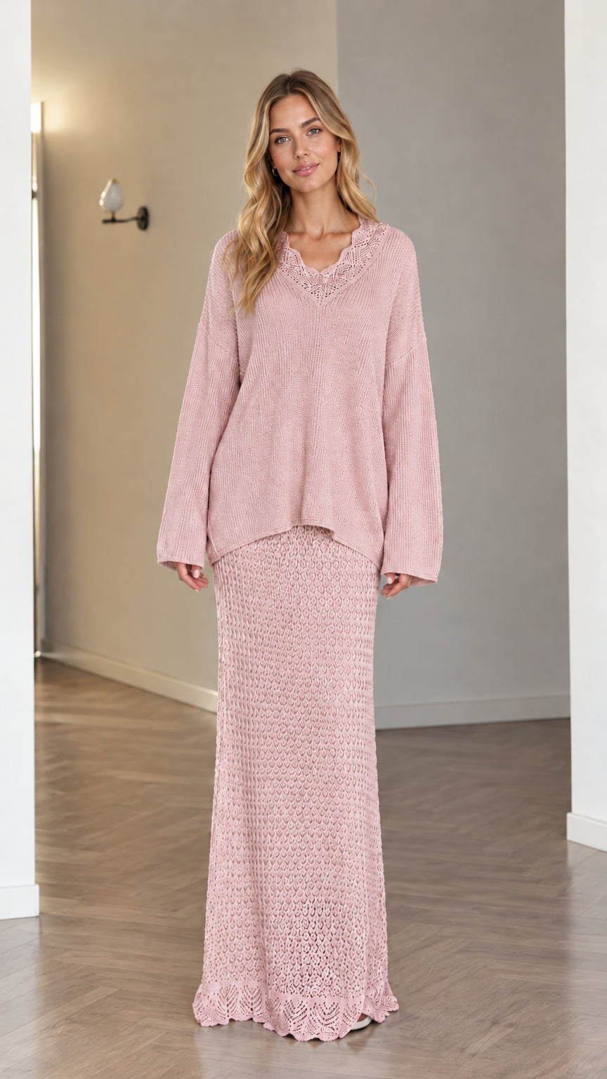 Model wearing dusty pink two-piece knit sweater and maxi skirt set