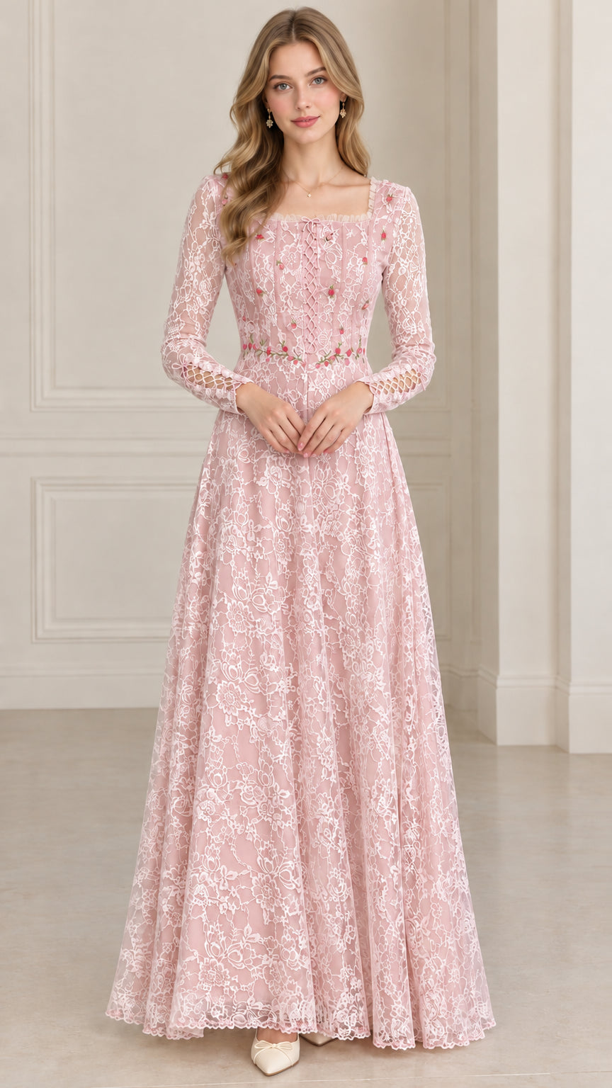 Front full-length view of model in blush pink floral embroidered lace maxi dress
