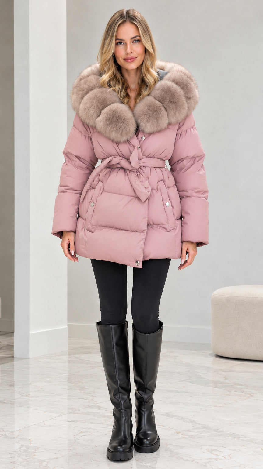 Front view of model wearing dusty pink belted quilted puffer coat