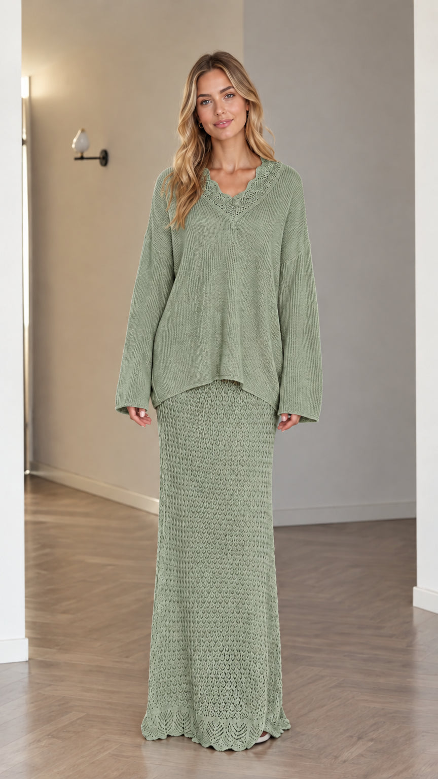 Model wearing sage green two-piece crochet V-neck sweater and maxi skirt set