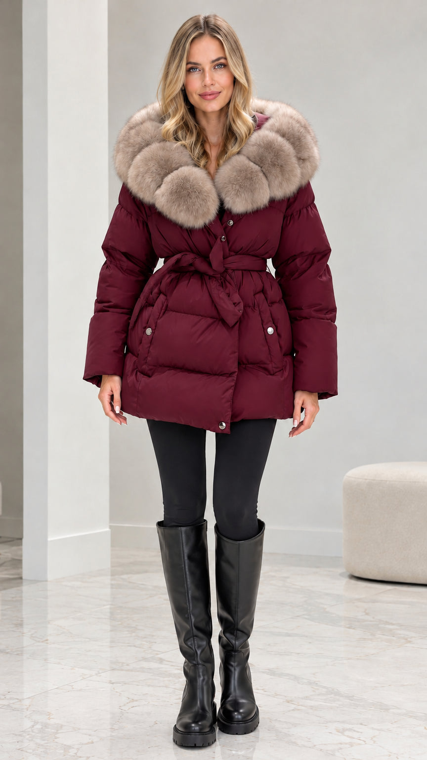 Front view of model wearing burgundy red belted quilted puffer coat