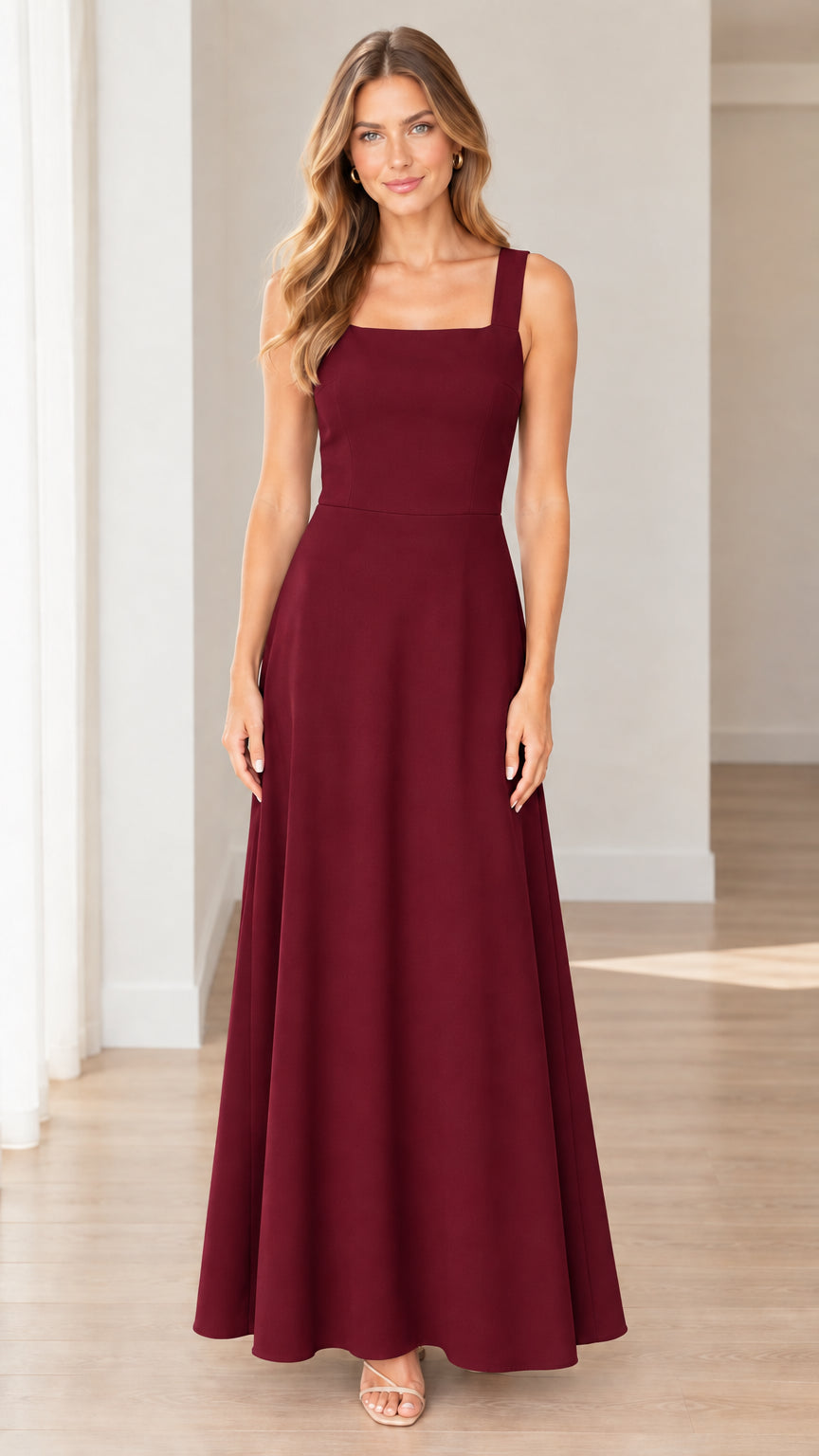 Front full-length view of model wearing burgundy sleeveless A-line gown