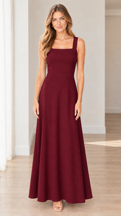 Front full-length view of model wearing burgundy sleeveless A-line gown
